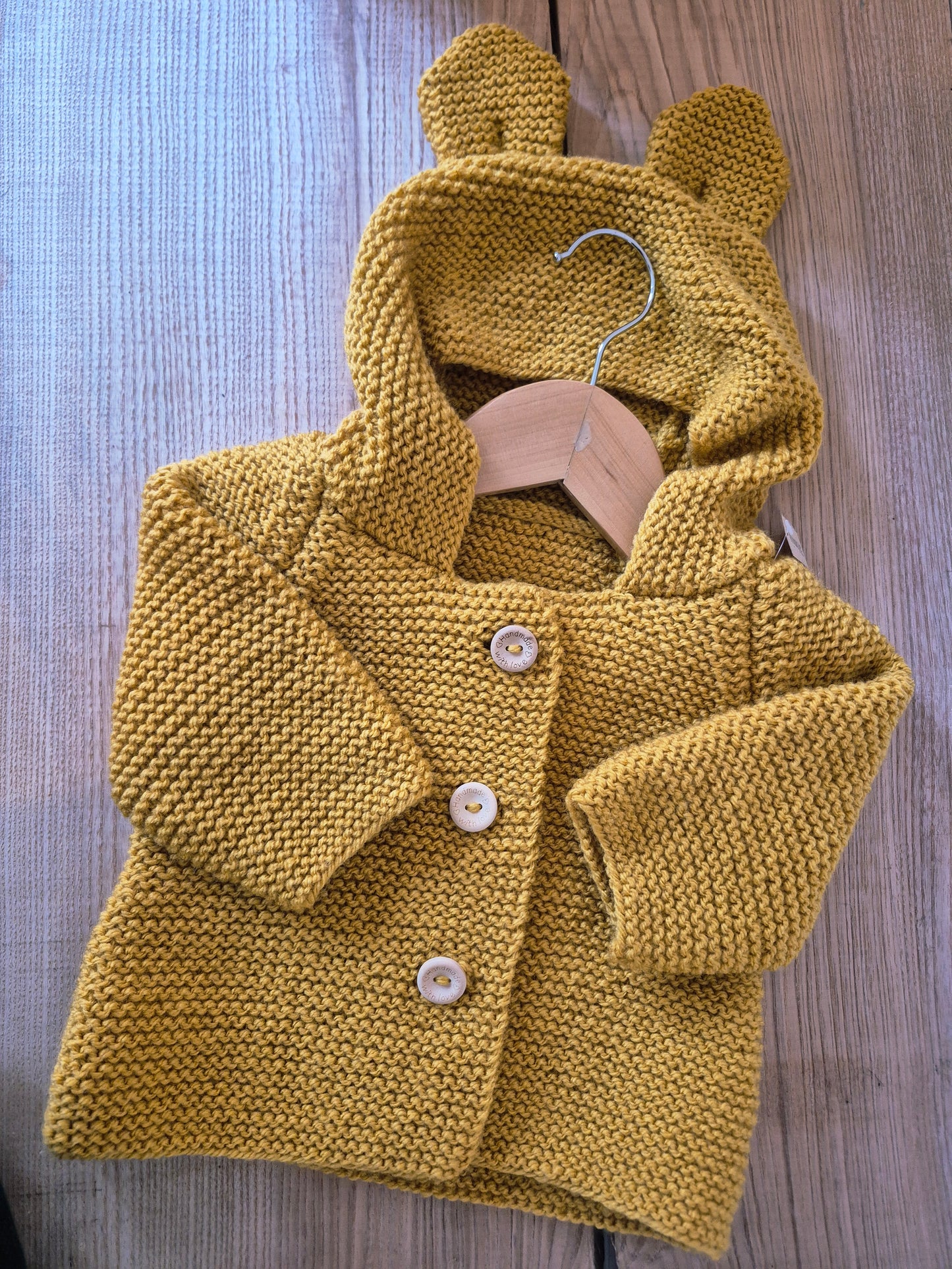 Gilet bébé en laine moutarde clair