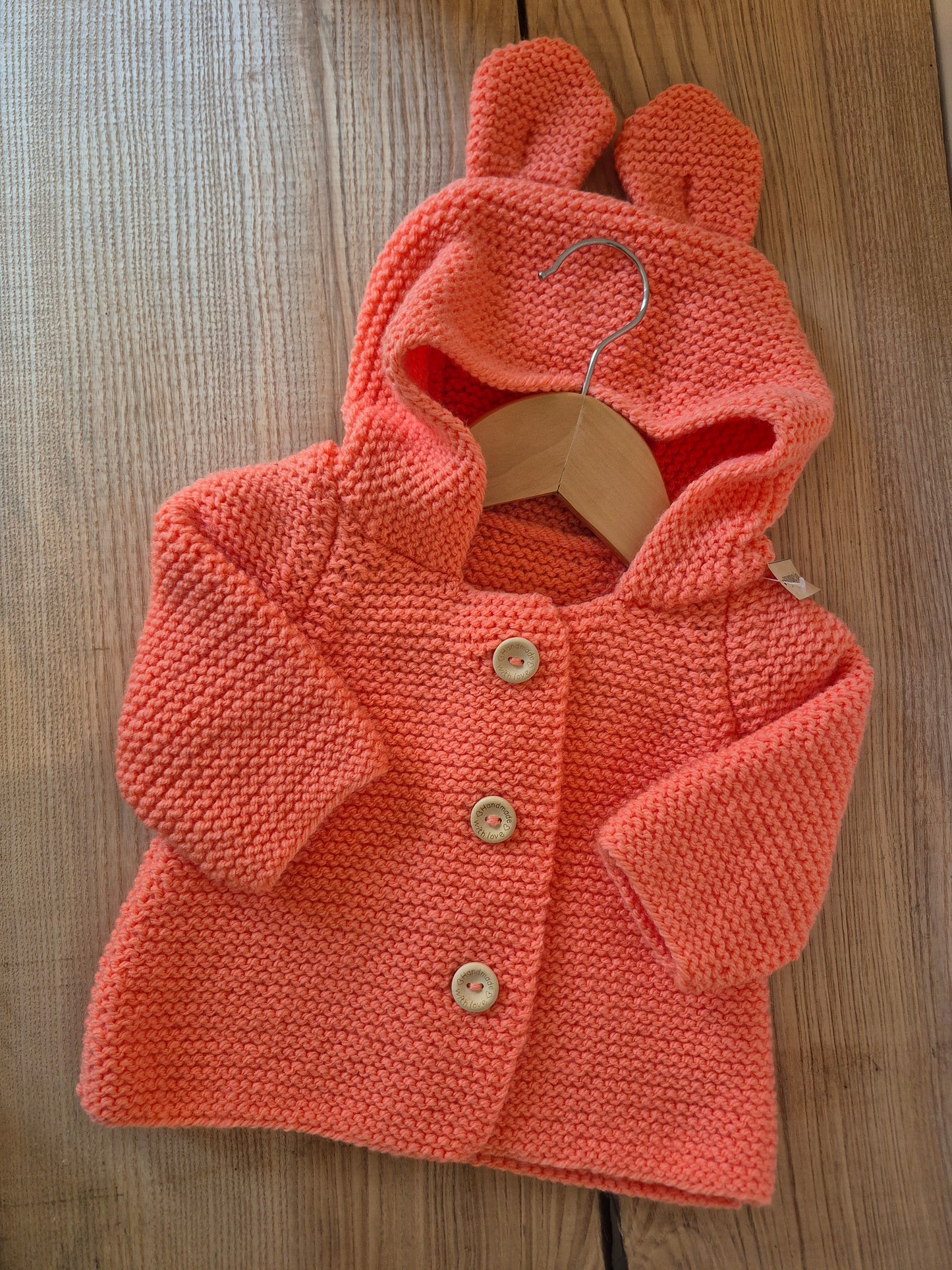 Gilet bébé en laine corail